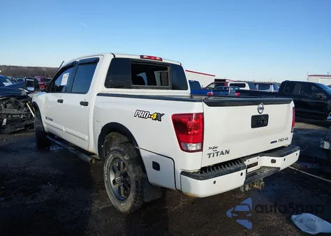 2015 Nissan Titan Pro-4X z USA, uszkodzony, nr VIN 1N6BA0EC7FN506202